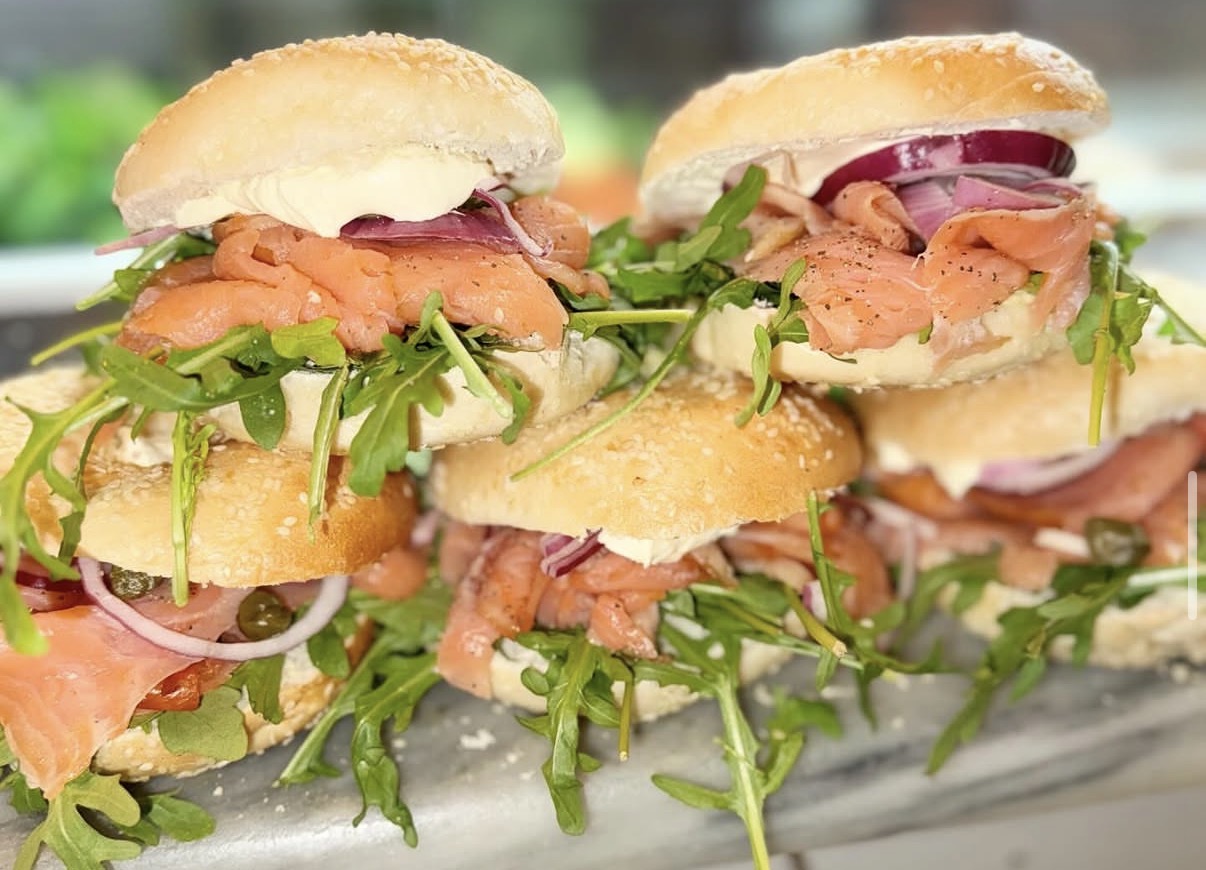 Smoked salmon bagels with cream cheese, red onion and rocket